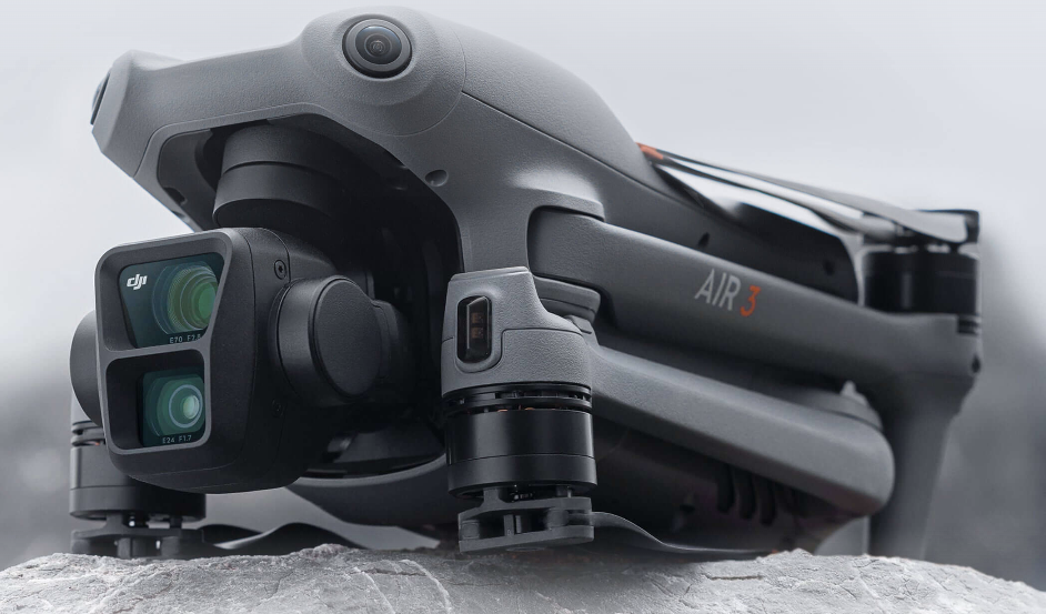 A grey drone with a camera Description automatically generated